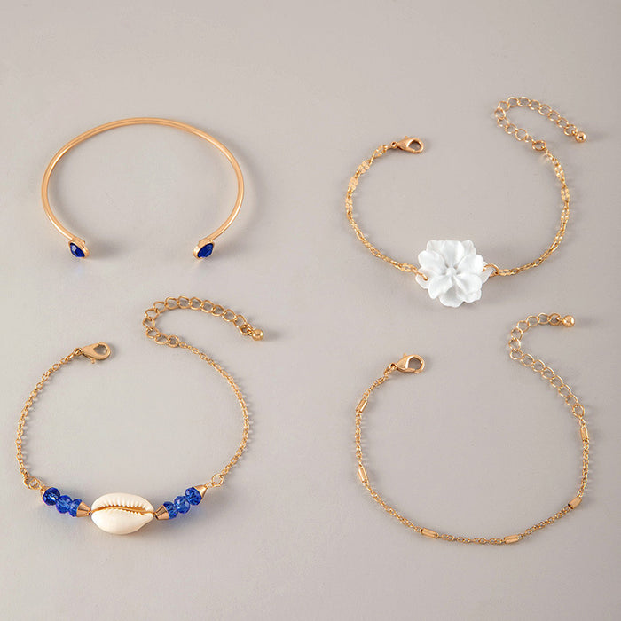 Conjunto de pulseras de conchas y estrellas de mar: cuatro piezas de joyería de aleación de oro para mujer