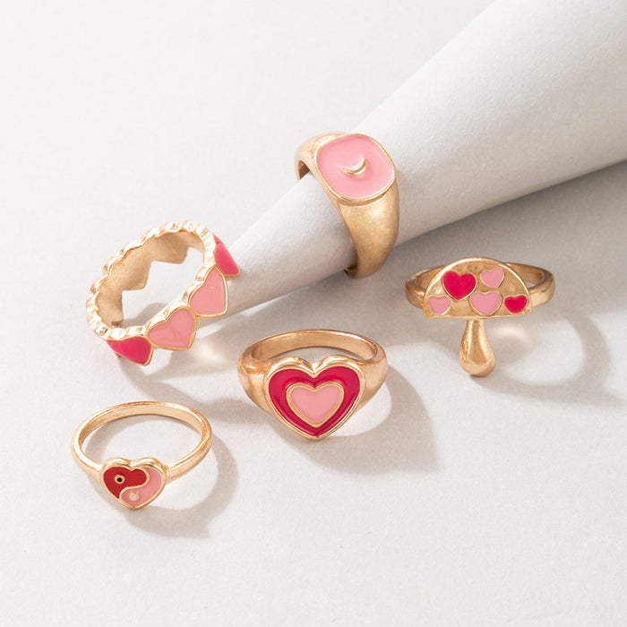 Anillo de 5 piezas con forma de hongo y corazón rosa con forma de gota de aceite de Tai Chi