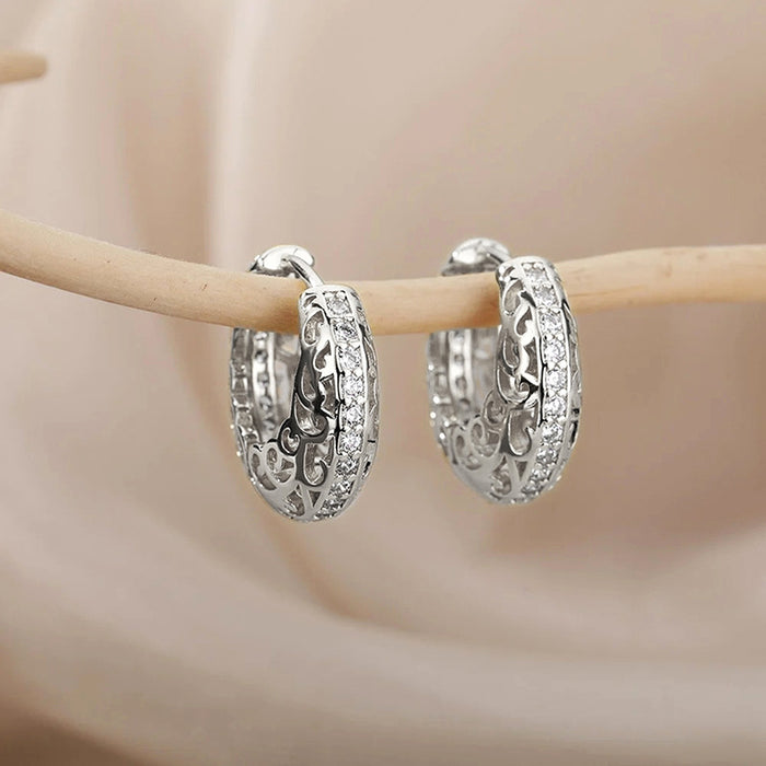 Hollow floral earrings with geometric shapes