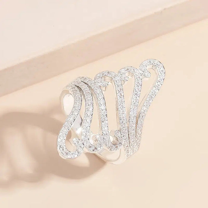 Long exaggerated hollow decorative ring, wave shell pattern ring