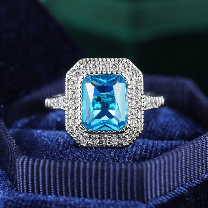 Anillo de mujer con circonita azul marino bañado en cobre y diseño de diamantes completos