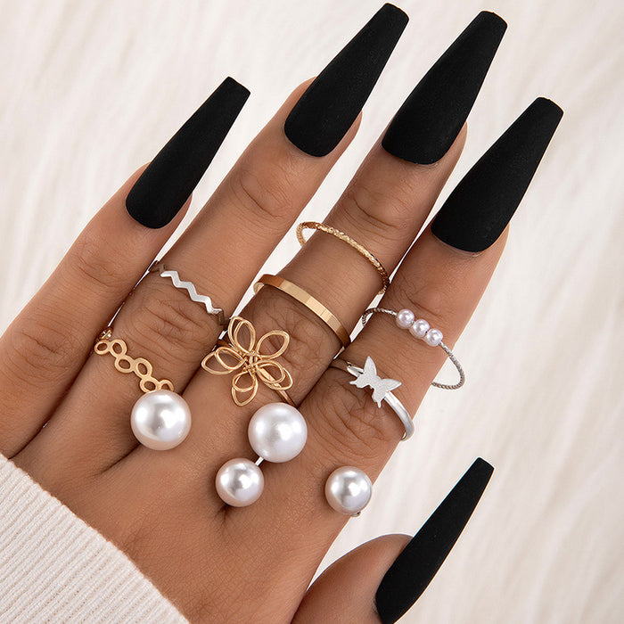 Conjunto de anillo de perlas de nueve piezas con diseño de nicho simple