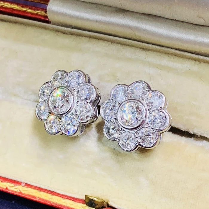 Women's flower stud earrings with diamonds