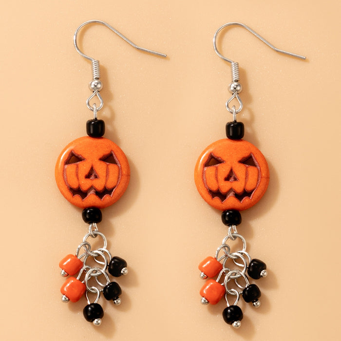 Pendientes de cuerda elástica con cuentas de arroz de colores y calaveras de Halloween