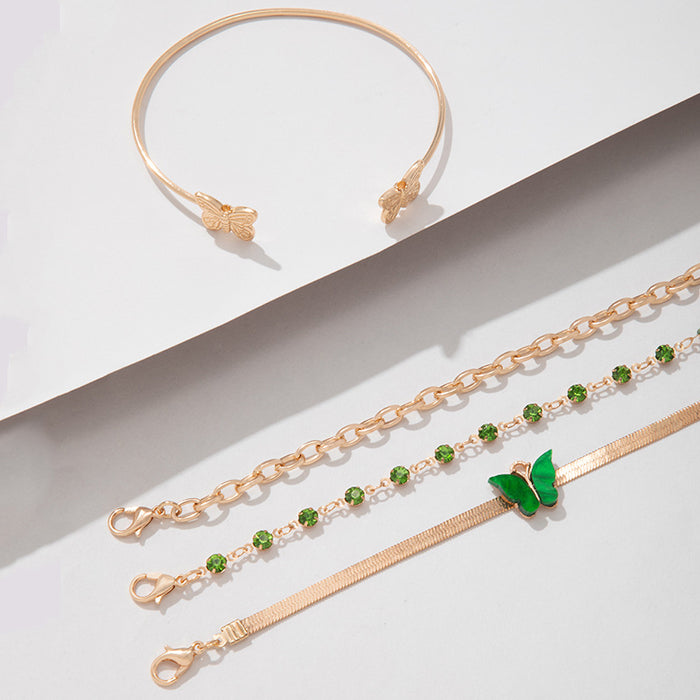 Conjunto de pulseras de diamantes de imitación verdes: brazalete de acrílico y mariposa de cuatro piezas