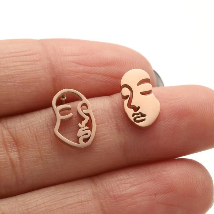 Pendientes de cara humana abstracta, pendientes huecos asimétricos divertidos de estilo europeo y americano, venta al por mayor transfronteriza de AliExpress