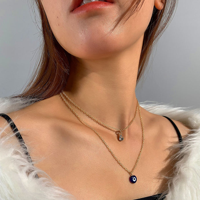 Collar con colgante de ojo de doble capa con incrustaciones de piedras preciosas: joyería única y elegante para mujeres