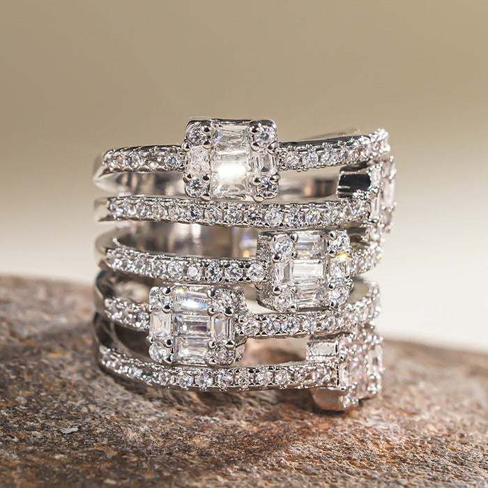 Women's multi-layered ring with micro-set half-circle diamonds
