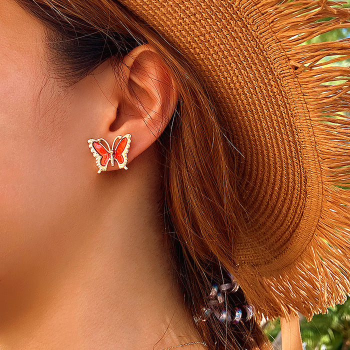 Pendientes geométricos con forma de gota de aceite en color rojo