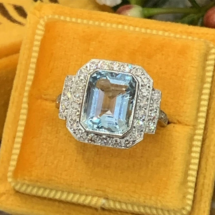 Anillo de aniversario de alta gama con circonita azul marino cuadrada de lujo