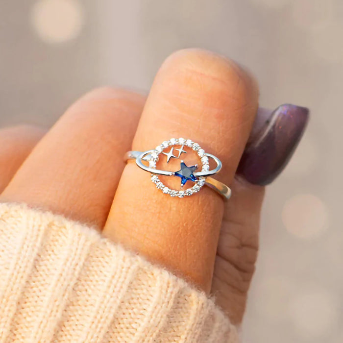 Anillo de moda con diseño de estrella planetaria y incrustaciones de circonitas para mujer