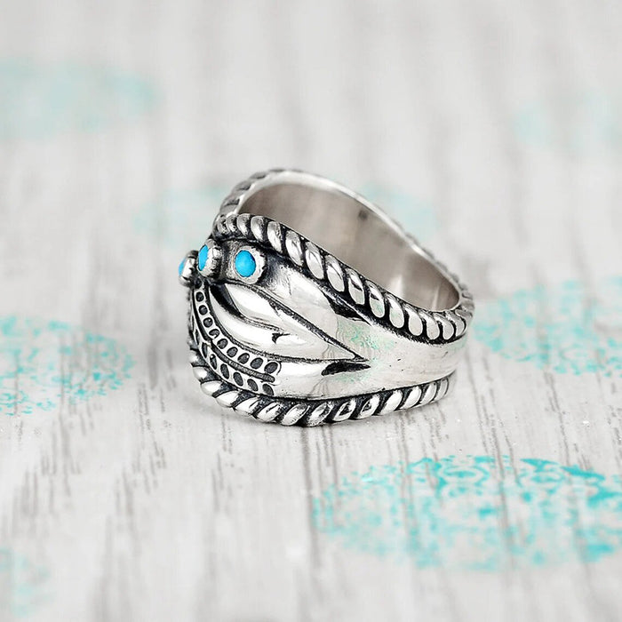 Women's imitation turquoise twisted lock edge vintage ring