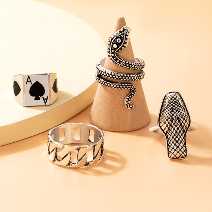 Exaggerated snake-shaped geometric spade A ring set