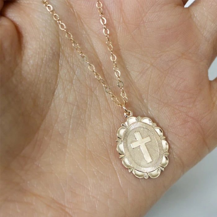 Gold cross necklace can be worn in multiple layers with clavicle chain