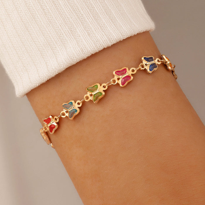 Pulsera de una sola capa con mariposas coloridas y dije geométrico de animales