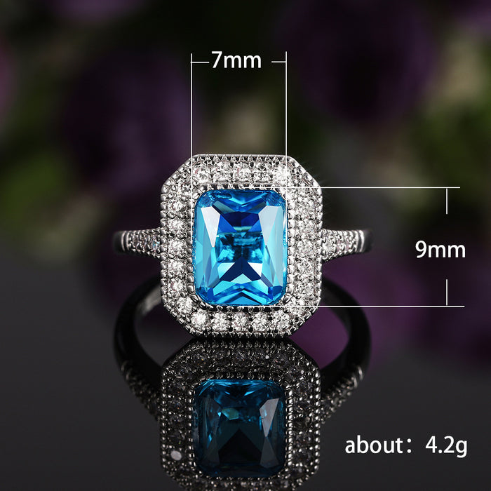 Anillo de mujer con circonita azul marino bañado en cobre y diseño de diamantes completos