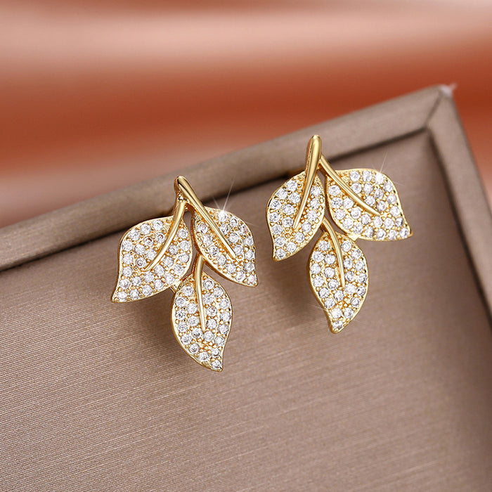 Exquisitos pendientes de hojas de diamantes, versátiles pendientes florales.