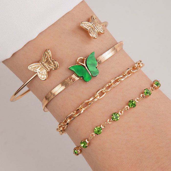 Conjunto de pulseras de diamantes de imitación verdes: brazalete de acrílico y mariposa de cuatro piezas