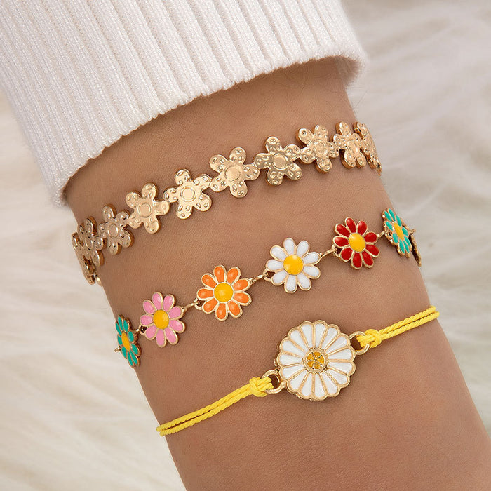 Conjunto de pulseras con flores de margaritas: joyería de mujer en tres piezas en tonos pastel