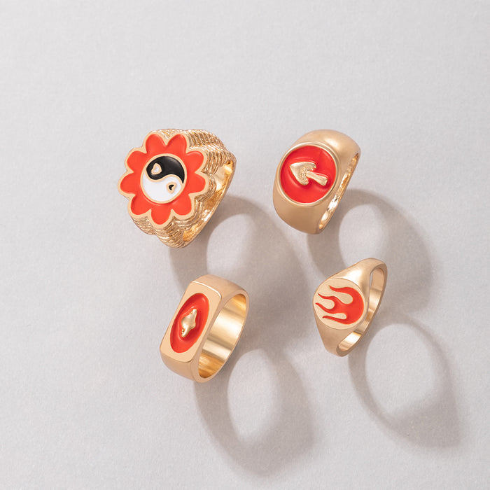 Juego de 4 anillos geométricos con gotas de aceite de flores rojas