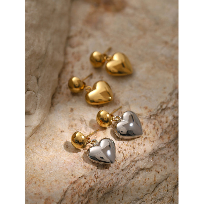 Pendientes asimétricos de acero inoxidable y oro de 18 quilates con forma de corazón: joyas con un diseño único en dos tonos