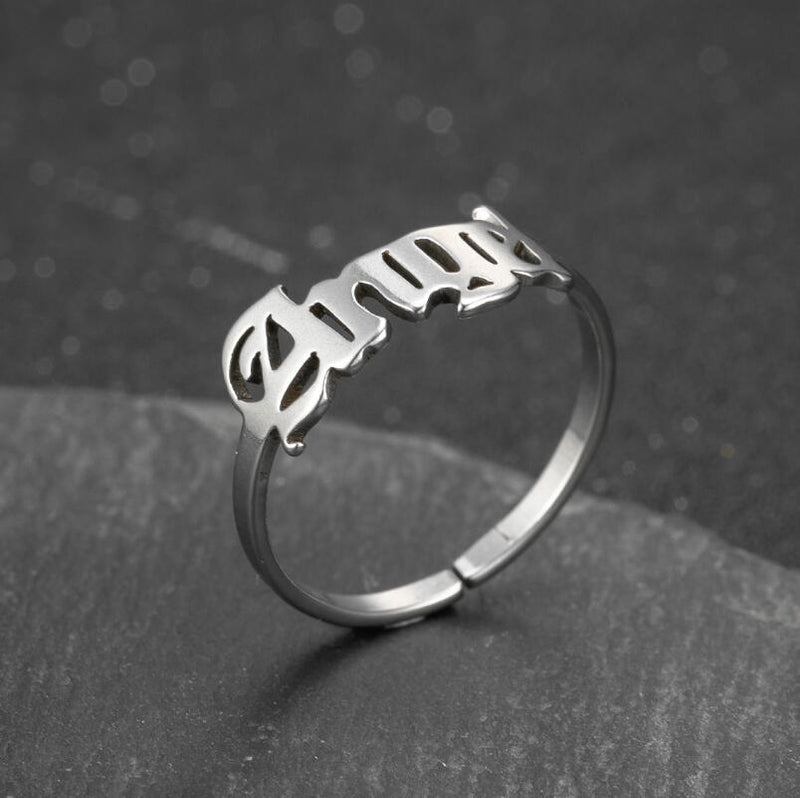 Anillo de acero inoxidable con letras de ángel simples japonesas y coreanas al por mayor