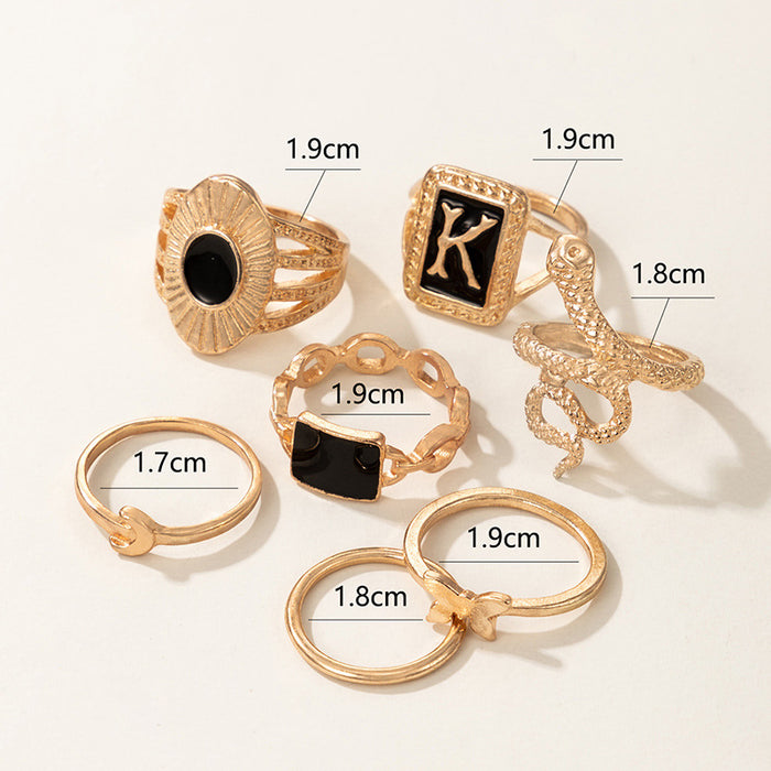 Dark gold letter K snake butterfly seven-piece ring set