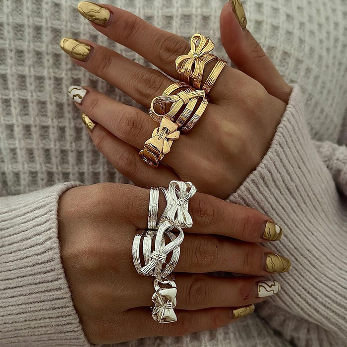 Stainless steel bow ring with diamonds