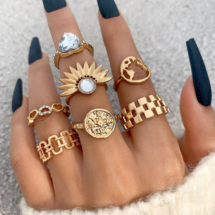 Anillo hueco de siete piezas con diamantes en forma de corazón y conjunto geométrico de girasol