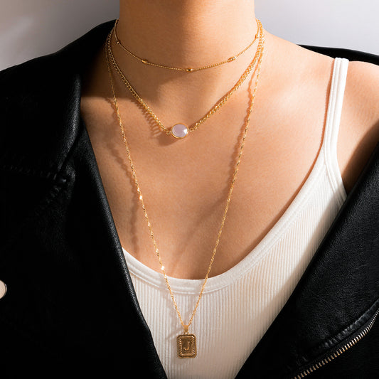 Collar multicapa con borlas de perlas: estilo minimalista moderno para mujeres