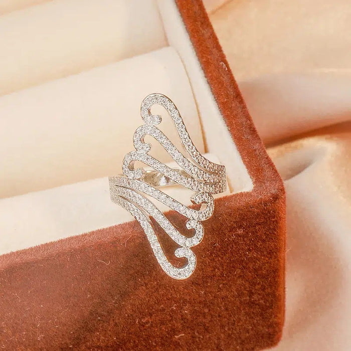 Long exaggerated hollow decorative ring, wave shell pattern ring