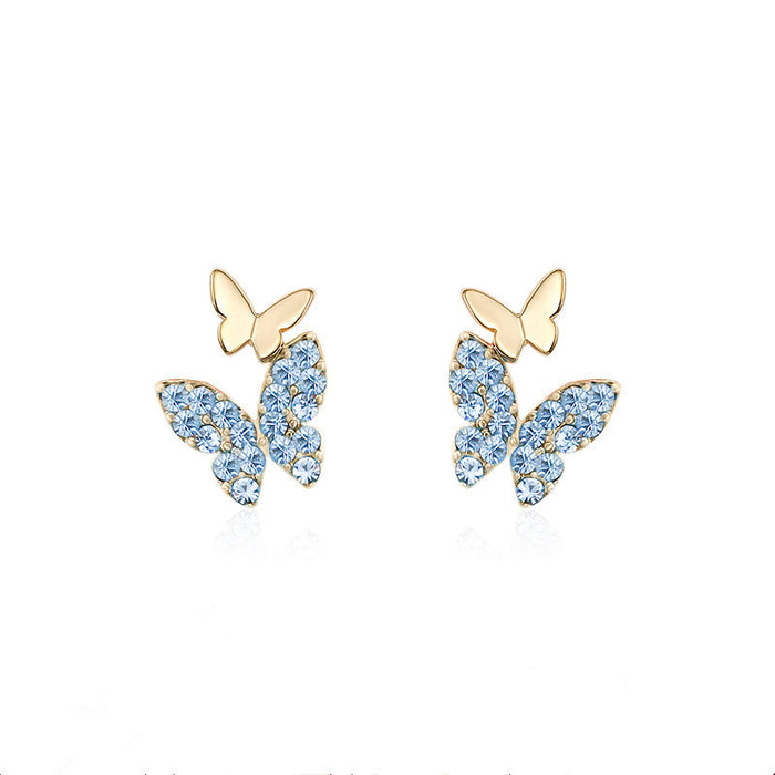 Lindos y pequeños pendientes de mariposa, pendientes sencillos y elegantes.