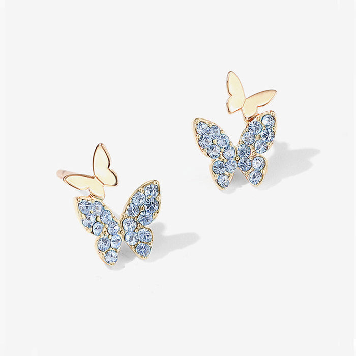 Lindos y pequeños pendientes de mariposa, pendientes sencillos y elegantes.