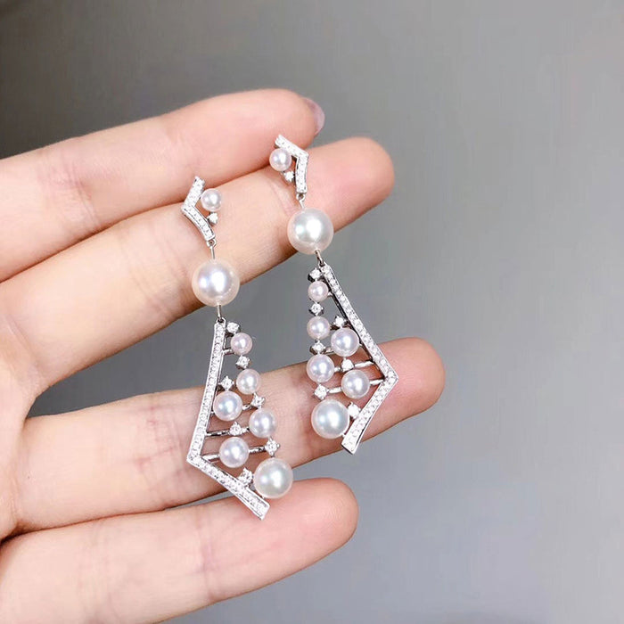 Pendientes de perlas de imitación de lujo, pendientes largos irregulares, pendientes de temperamento europeo y americano para mujer