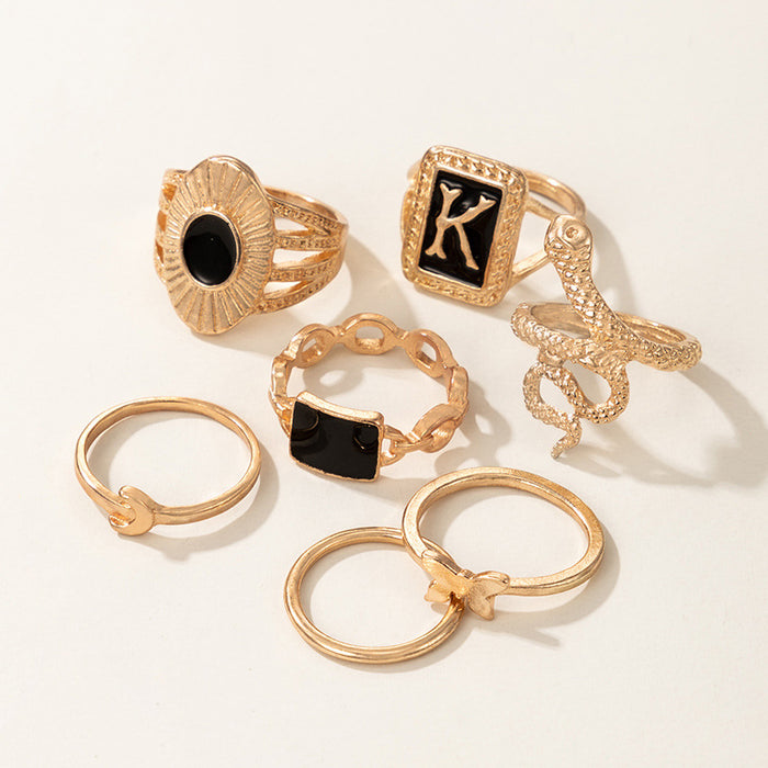 Dark gold letter K snake butterfly seven-piece ring set