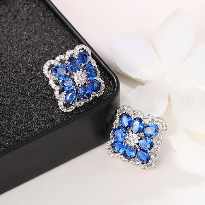 Blue enchantress flower earrings