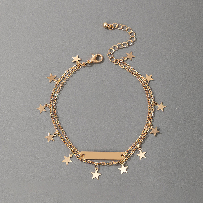 Tobillero minimalista dorado con borlas y estrellas para mujer