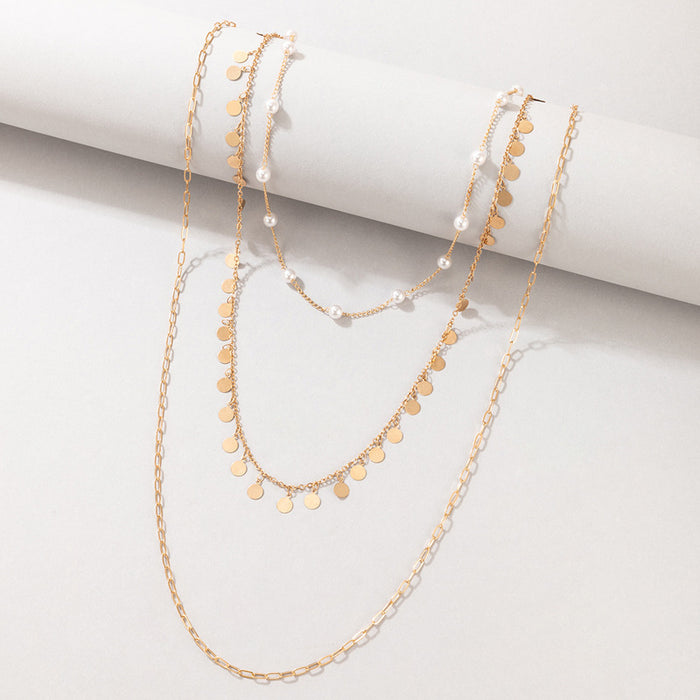 Pearl and Metal Multi-Layer Necklace with Geometric Round Disc Design