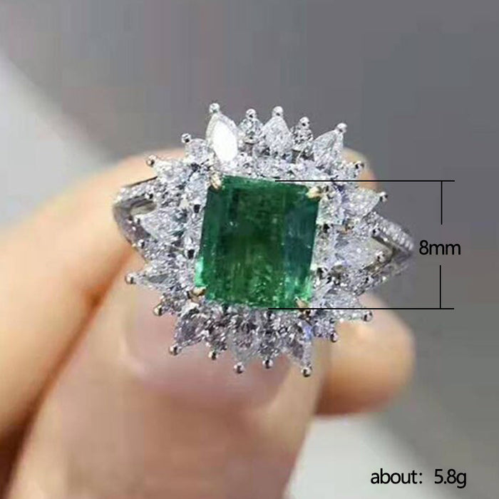 Anillo de lujo con circón esmeralda cuadrado y incrustaciones de diamantes