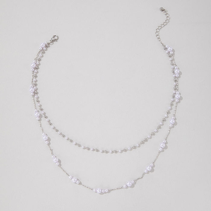 Double Layered Pearl and Metal Chain Necklace - Sophisticated and Trendy Design