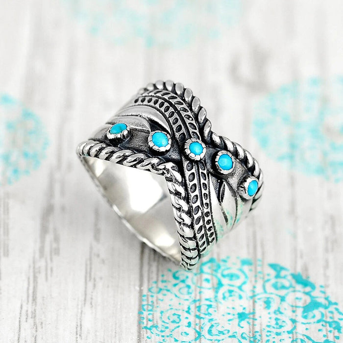 Women's imitation turquoise twisted lock edge vintage ring