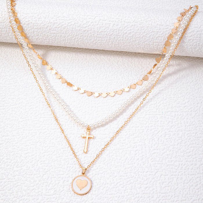 Heart Pendant Necklace with Cross and Pearl Charms - Geometric Multilayered Jewelry for Women