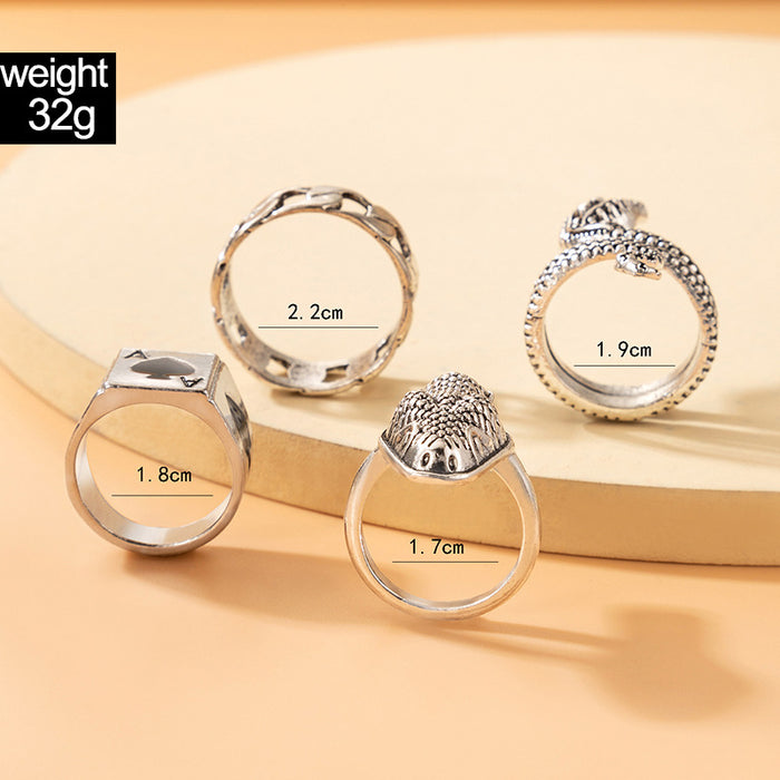 Exaggerated snake-shaped geometric spade A ring set