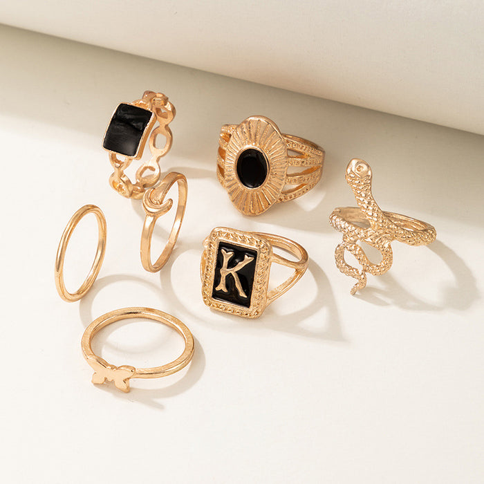 Dark gold letter K snake butterfly seven-piece ring set