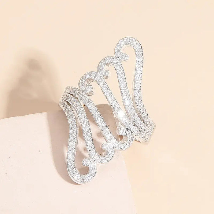 Long exaggerated hollow decorative ring, wave shell pattern ring