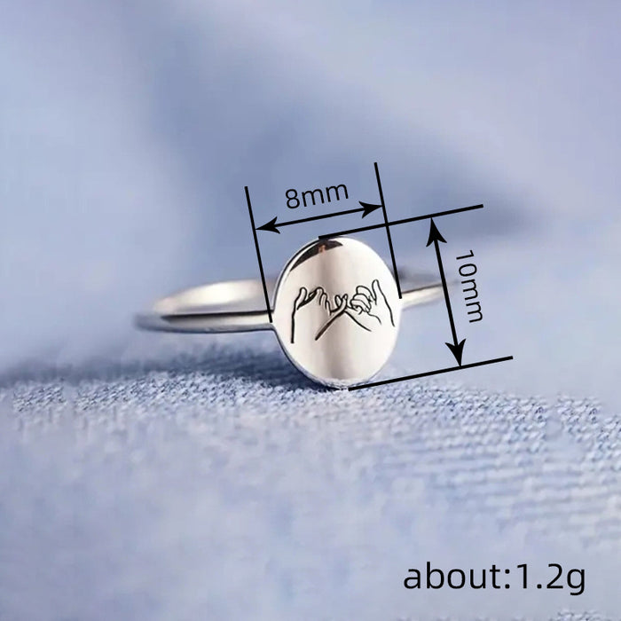 Women's geometric oval laser engraved ring