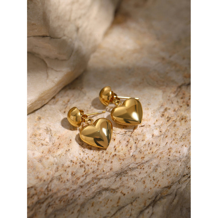 Pendientes asimétricos de acero inoxidable y oro de 18 quilates con forma de corazón: joyas con un diseño único en dos tonos