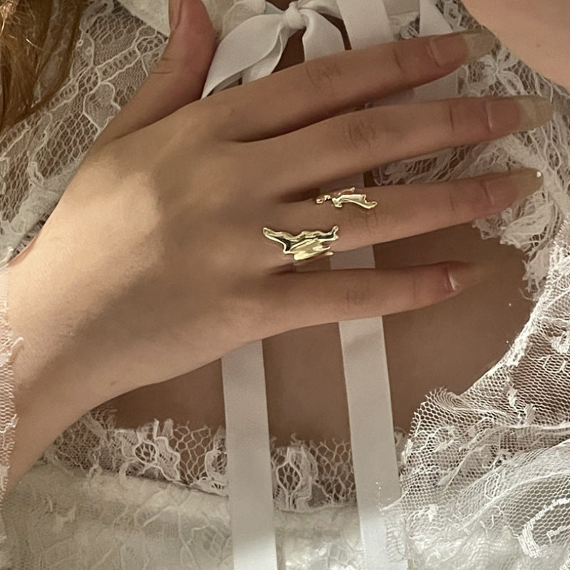 Irregular geometric gold ring with leaf opening