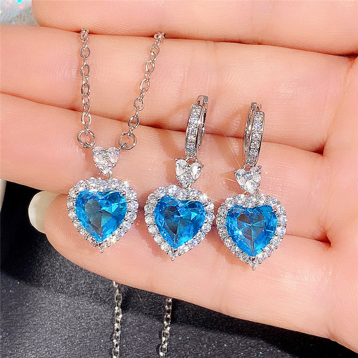 Conjunto de anillo y pendientes con forma de corazón de océano y circonita azul topacio