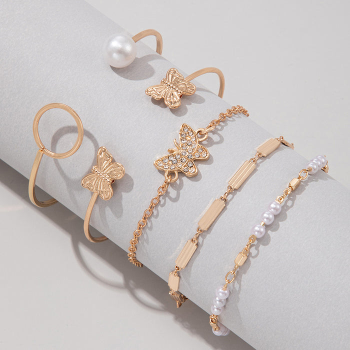 Conjunto de pulseras de cadena con forma de mariposa y perlas: cinco piezas de joyería con puños abiertos geométricos